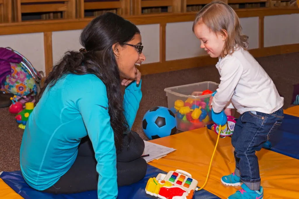 student of occupational therapy degree program working with pediatric patient