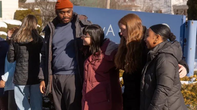 UNE students pose for a photo outside Ocean Avenue Elementary School